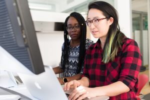 two women one teaching the other